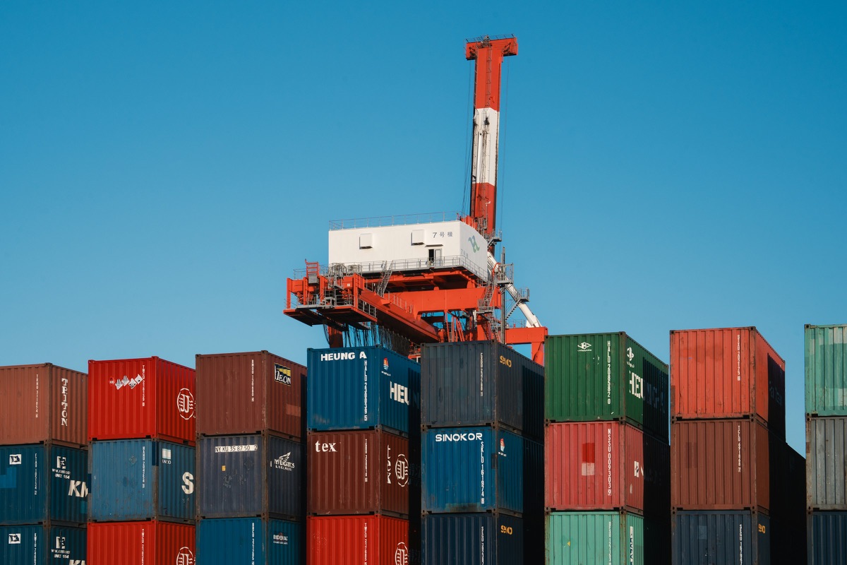 A gantry crane above a stack of shipping containers at a container terminal