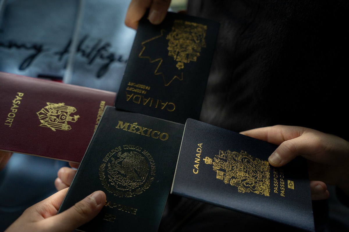 Investor holding several passports while preparing a Turkish citizenship application